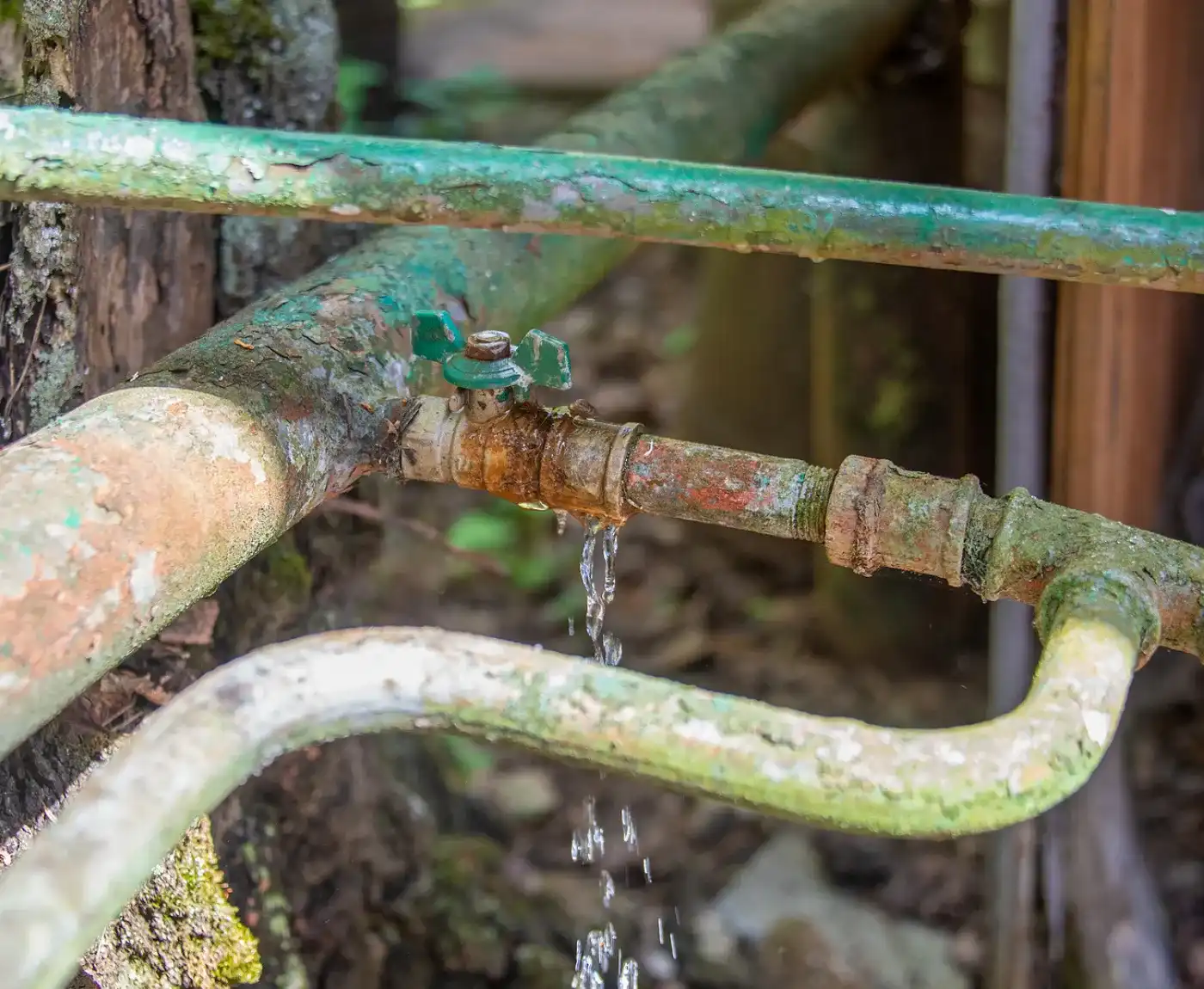 Leaking water main pipe being repaired by professional engineers in Sussex.