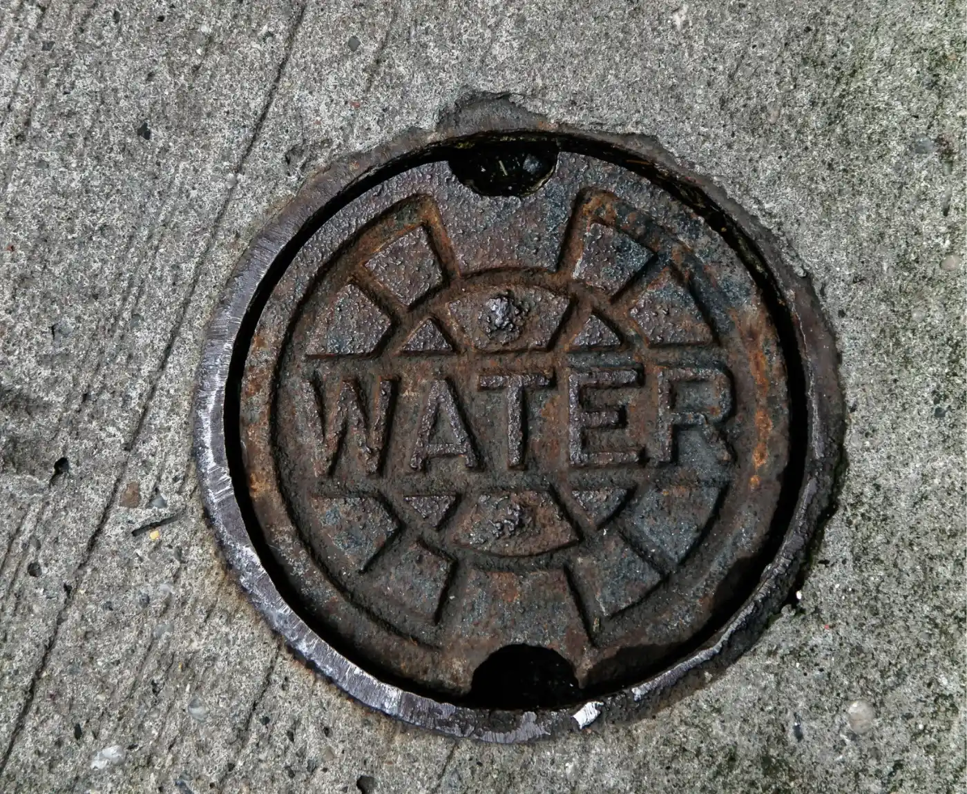 Water main access cover for professional water main replacement services